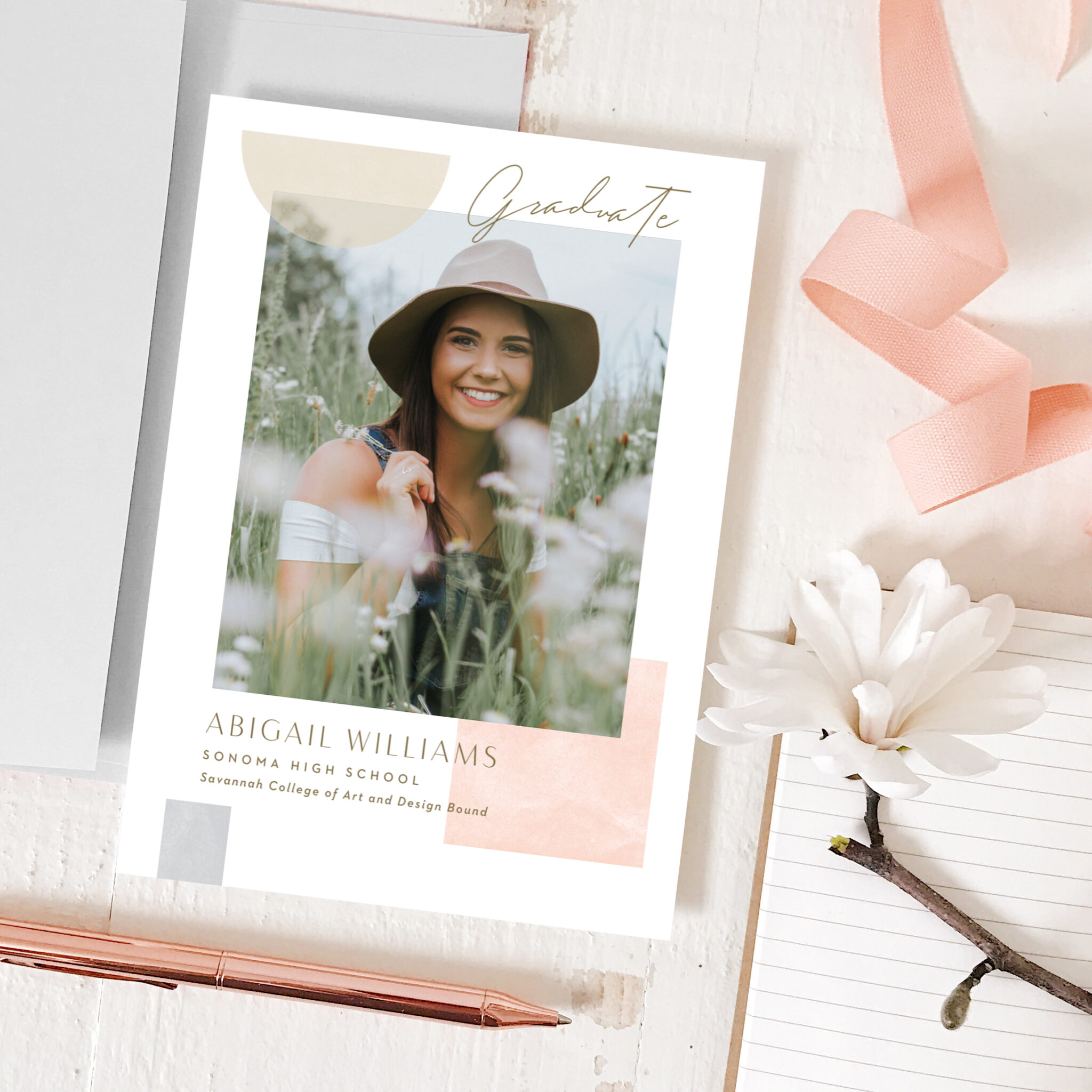 Personalized graduation announcement card featuring a smiling young woman in a field, designed by Basic Invite with soft peach and gray accents