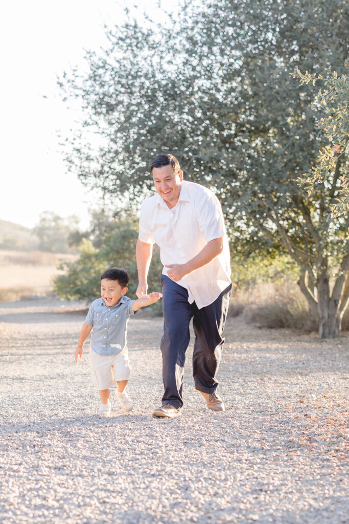 Father playing with his young son during a San Diego fall family photography session.
