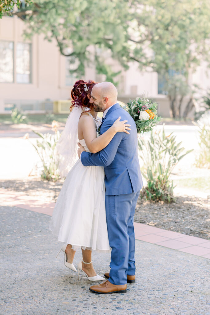 bride and groom hugging during San Diego courthouse wedding
