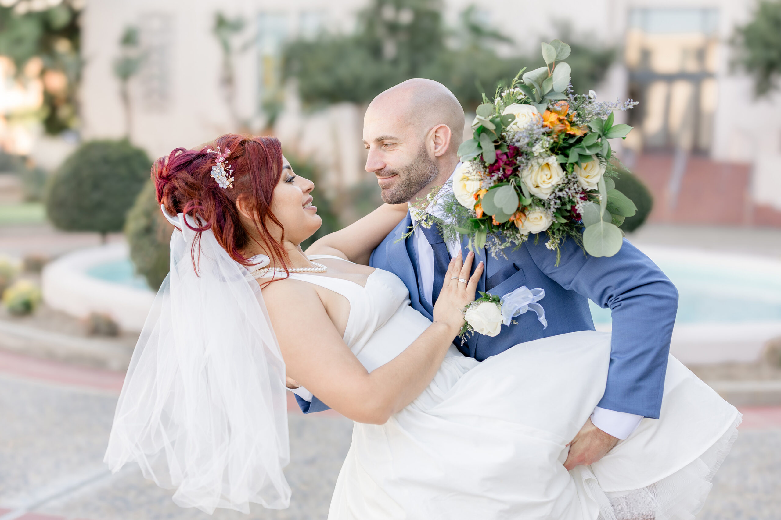 groom lifting bride during san diego courthouse wedding
